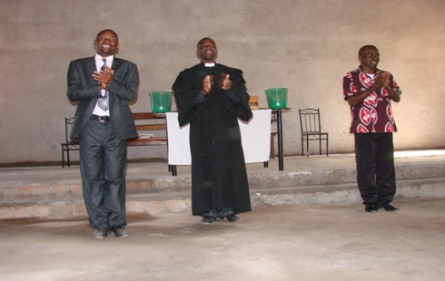 Mr Chimba Katuka (Left), Reverend Chipendano(middle) and Elder Chilufya David(Right) singing and giving praise to the Lord.